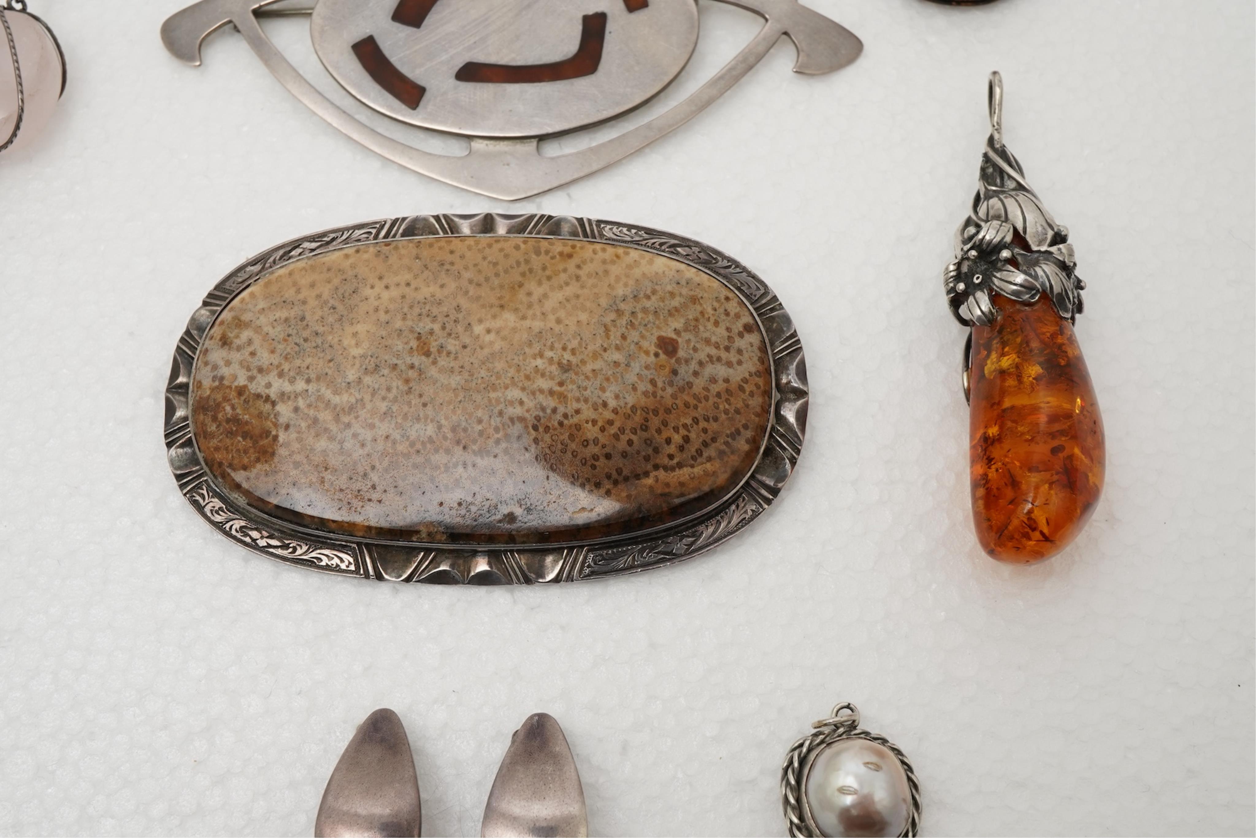 A collection of Arts & Crafts jewels including a pair of silver earrings by Georg Jensen